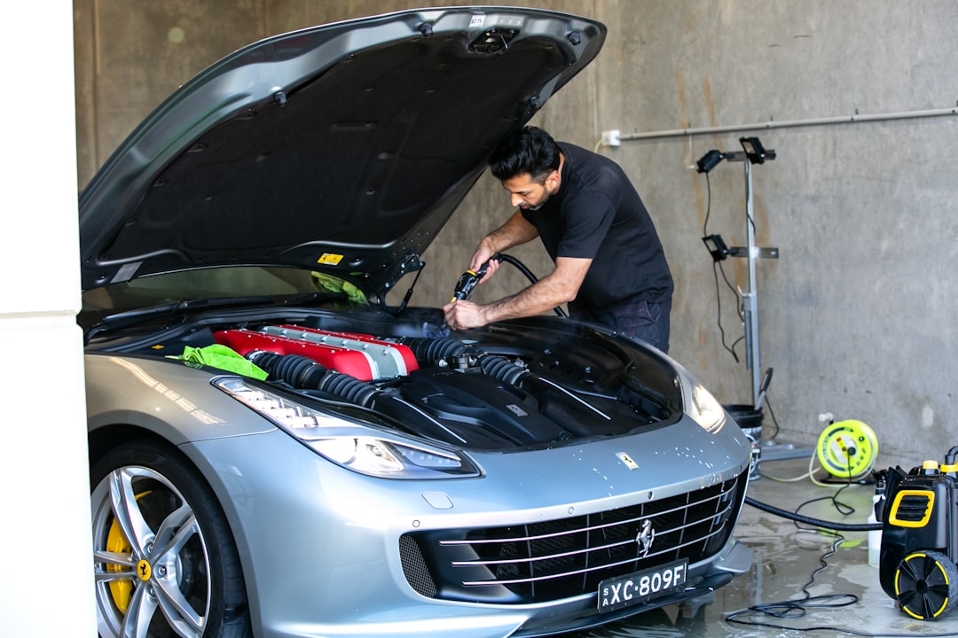 stats-img a-mechanic-is-working-on-a-ferrari-car-0w5ec5-niv0